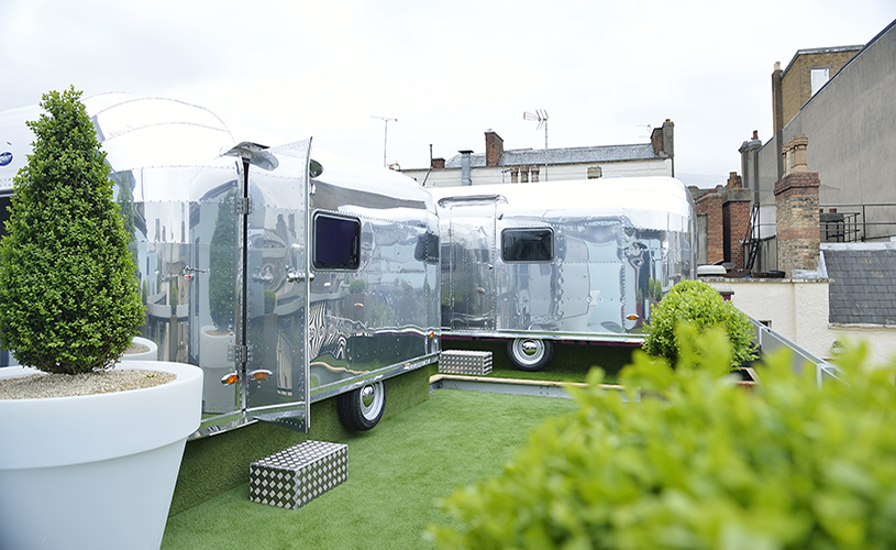 Silver airstream-style caravans on the rooftop of Brooks Guesthouse